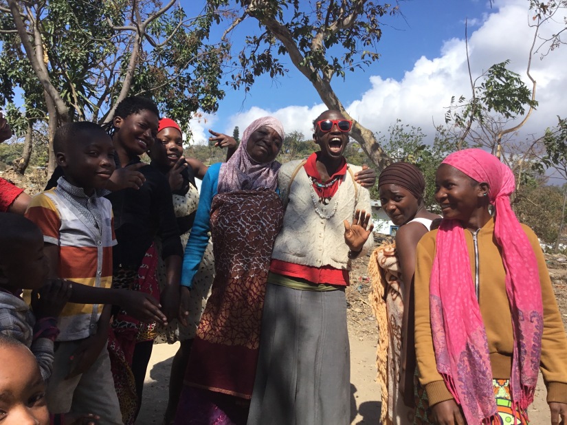 kuwa jasiri in Malawi posing with 6 villagers on an Ancestral Return Trip