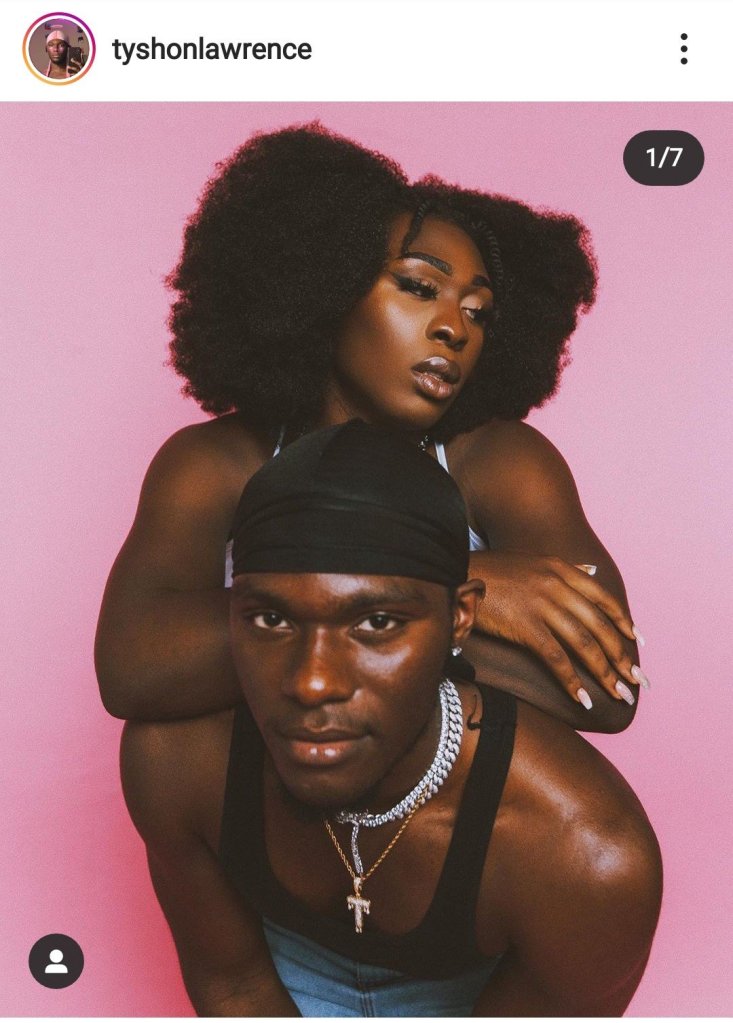 Two afro folks aganist a pink background.