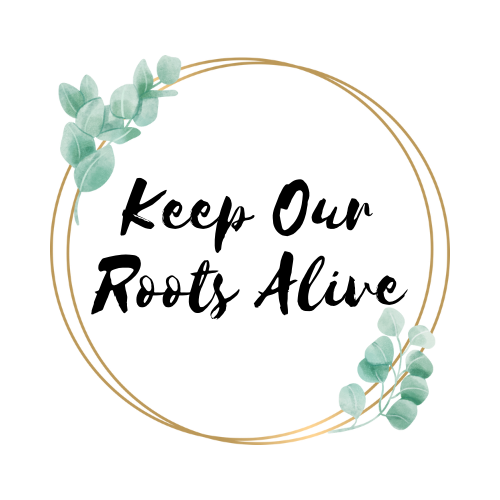 Two golden rings and mint-coloured flowers circle the words, Keep Our Roots Alive. The words are in a bold black cursive font.