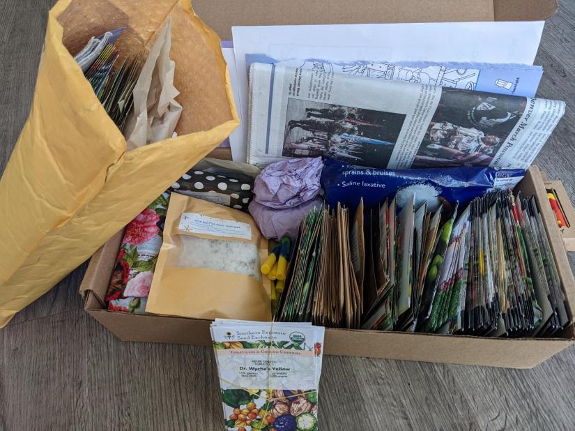 4 care packs varying in size. Each full of Seeds, hygiene, herbal medicine, and art.