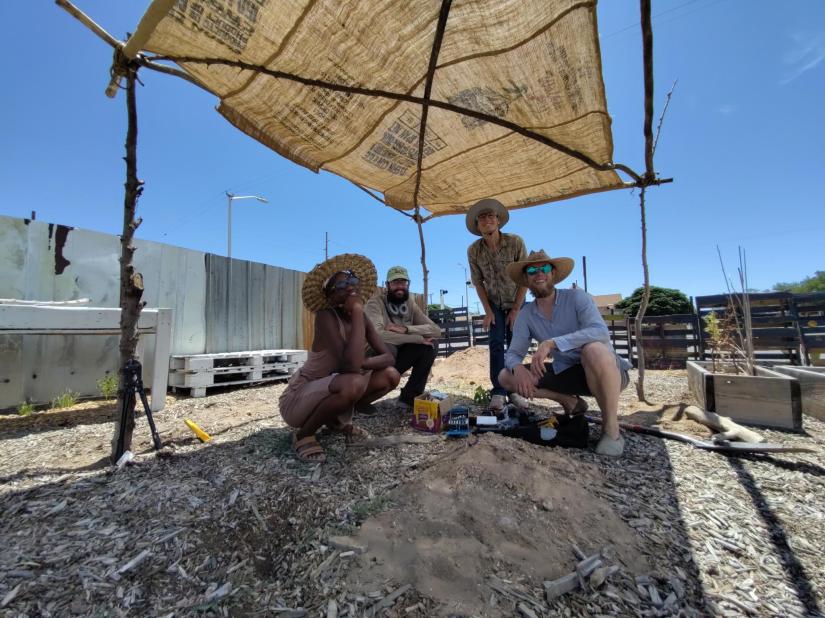 Racial Remedy Task Force basking in the newly erected shade structure from donated materials at the African Garden.